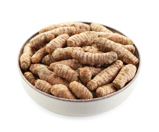 Photo of Tumeric rhizomes in bowl isolated on white