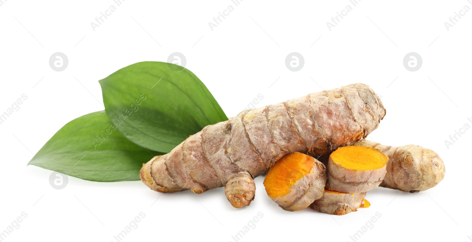 Photo of Tumeric rhizomes with leaves isolated on white