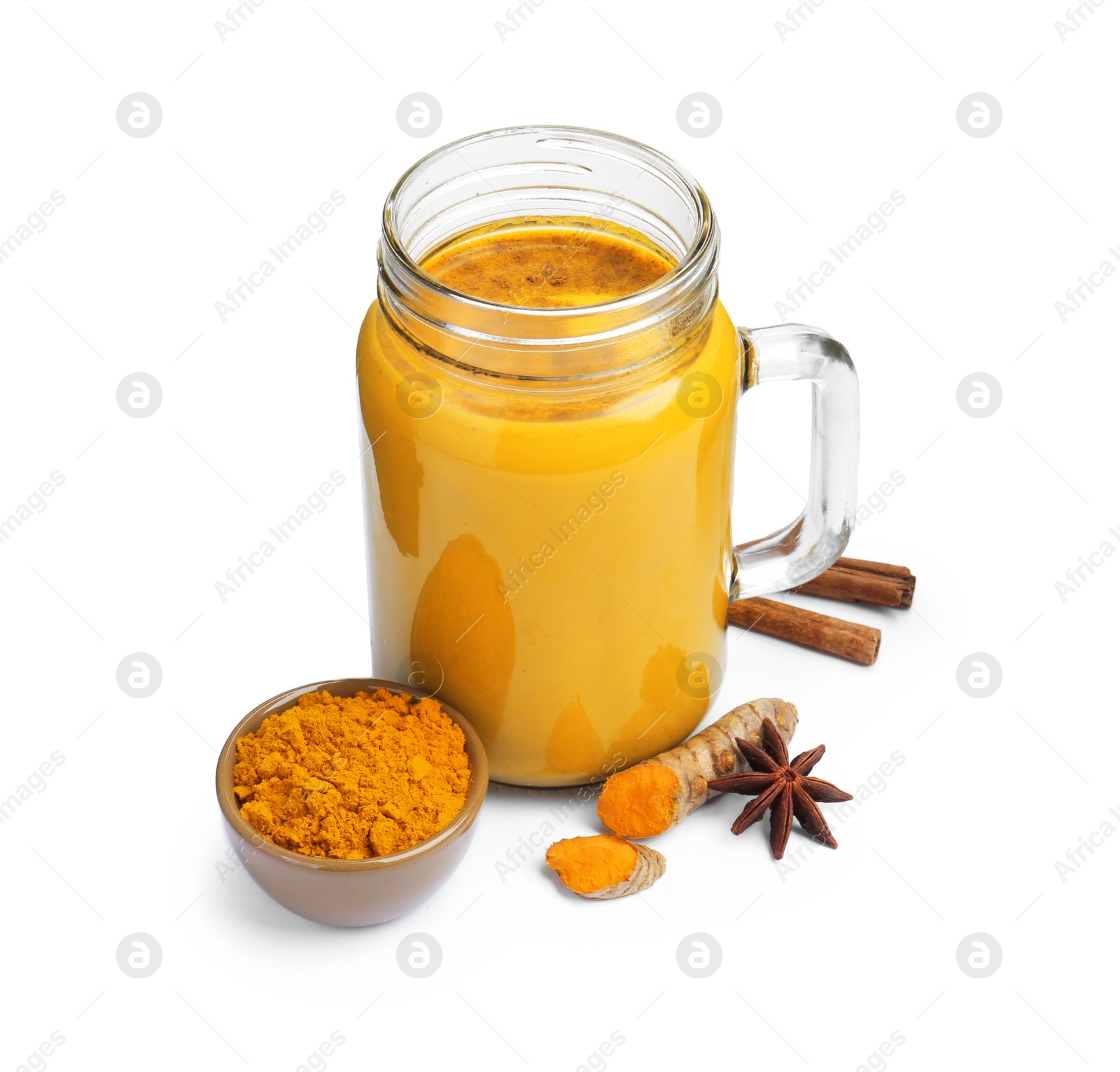 Photo of Delicious turmeric latte in mason jar and spices isolated on white