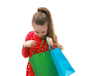 Cute little girl with shopping bags on white background