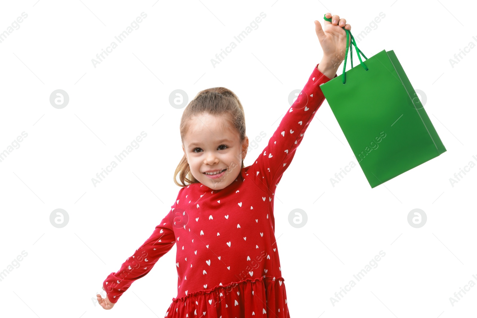 Photo of Happy little girl with shopping bag on white background