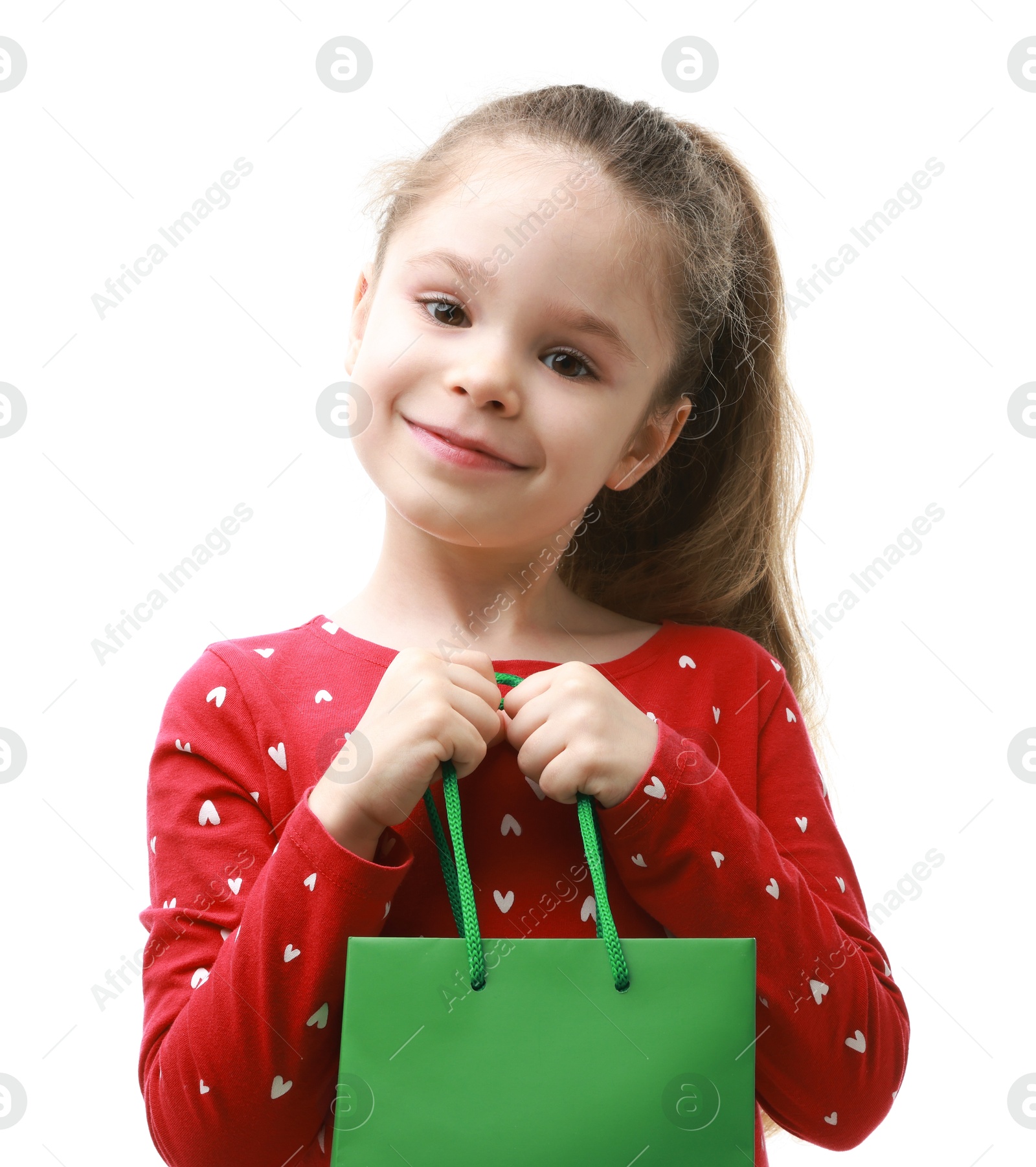 Photo of Cute little girl with shopping bag on white background