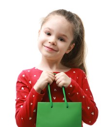 Cute little girl with shopping bag on white background