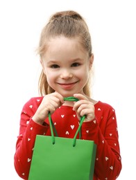 Cute little girl with shopping bag on white background