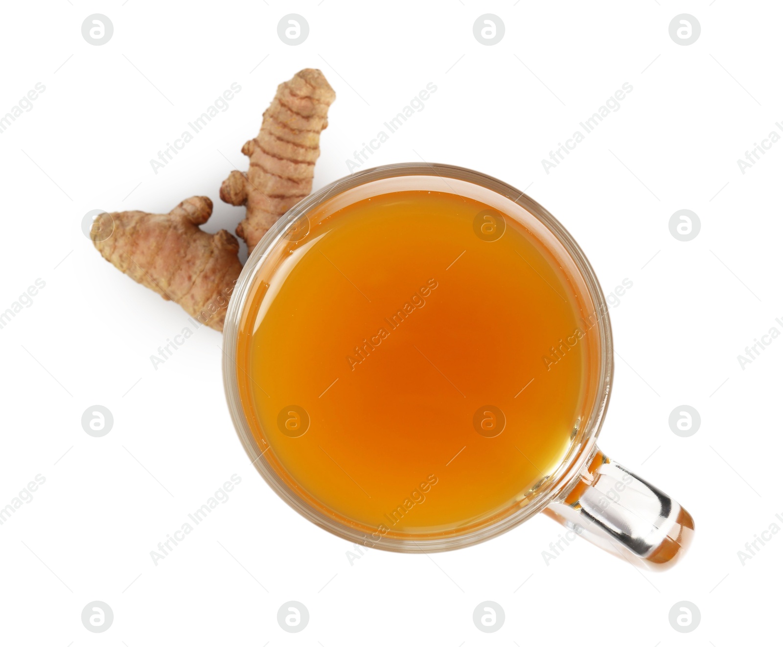 Photo of Aromatic turmeric tea in glass cup and roots isolated on white, top view