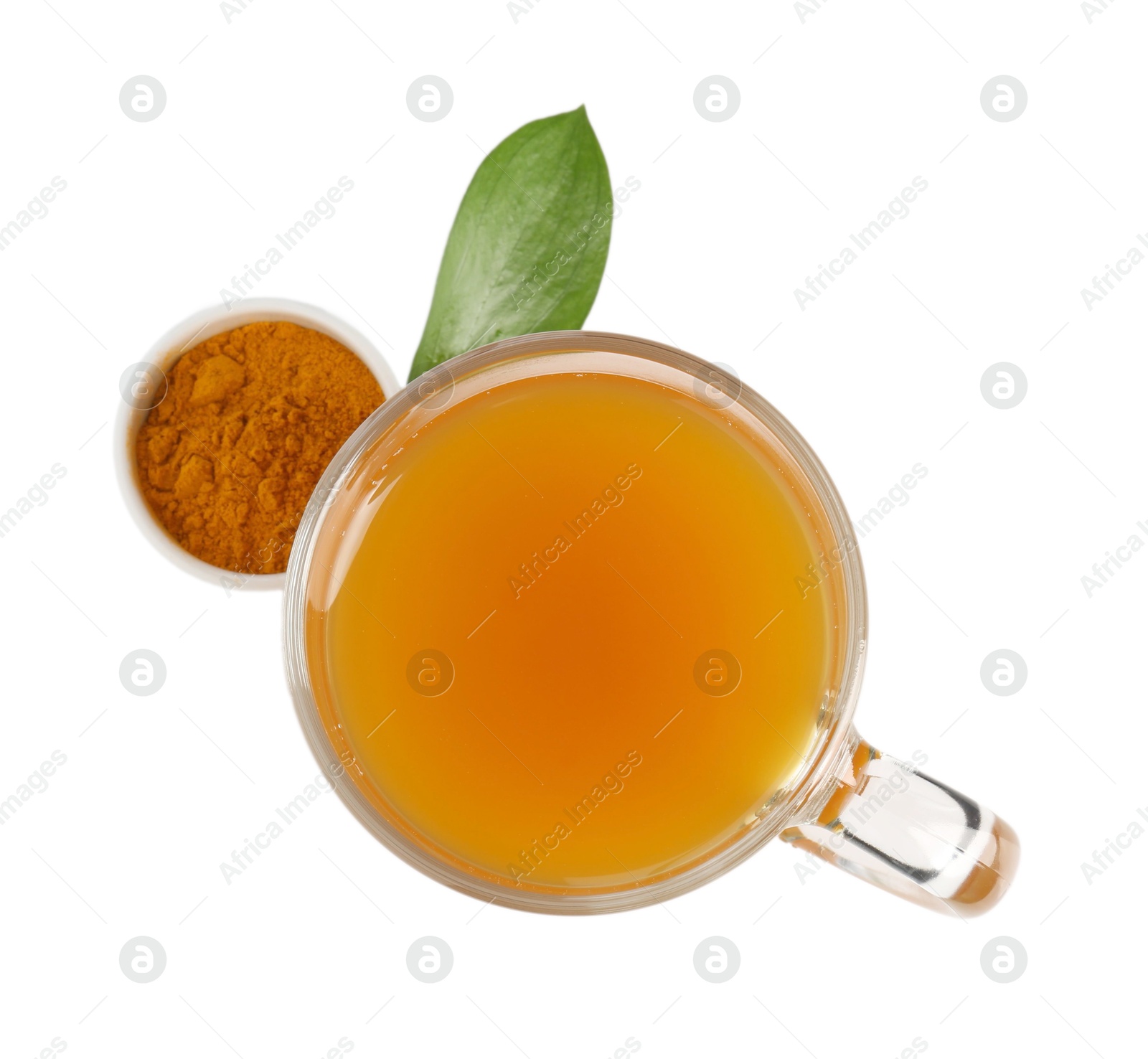 Aromatic turmeric tea in glass cup, powder and green leaf isolated on white, top view Photo of Aromatic turmeric tea in glass cup, powder and green leaf isolated on white, top view