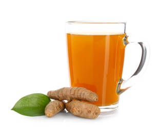 Photo of Aromatic turmeric tea in glass cup, roots and green leaf isolated on white