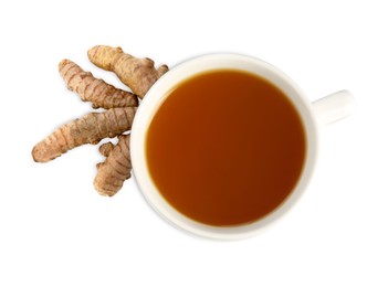 Photo of Aromatic turmeric tea in cup and roots isolated on white, top view