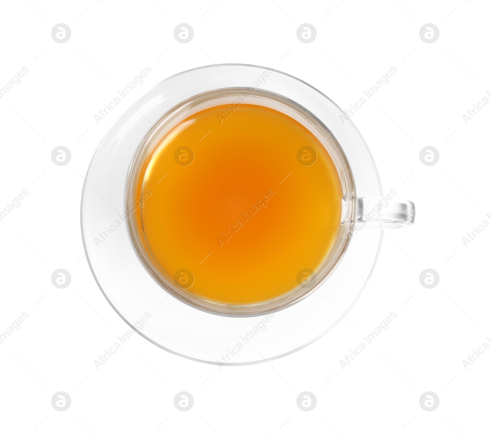 Photo of Aromatic turmeric tea in glass cup isolated on white, top view