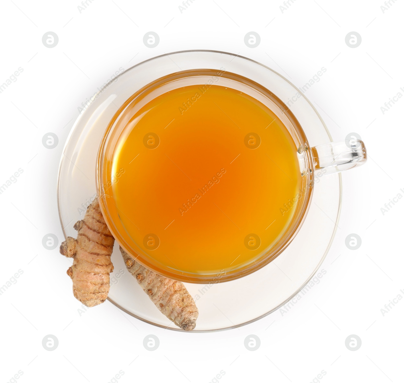 Photo of Aromatic turmeric tea in glass cup and roots isolated on white, top view