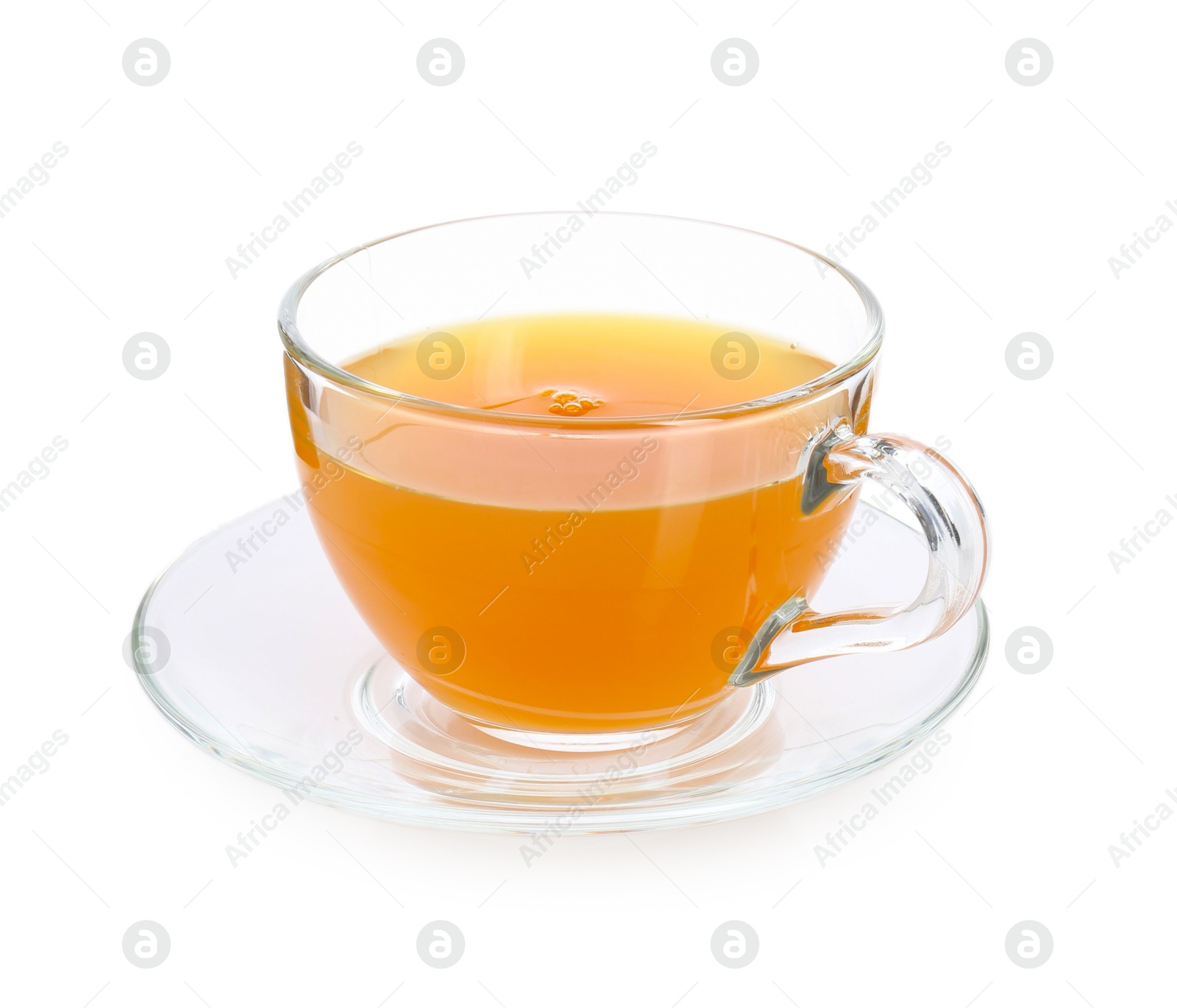 Photo of Aromatic turmeric tea in glass cup isolated on white