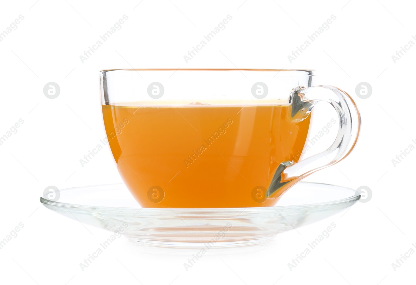 Photo of Aromatic turmeric tea in glass cup isolated on white