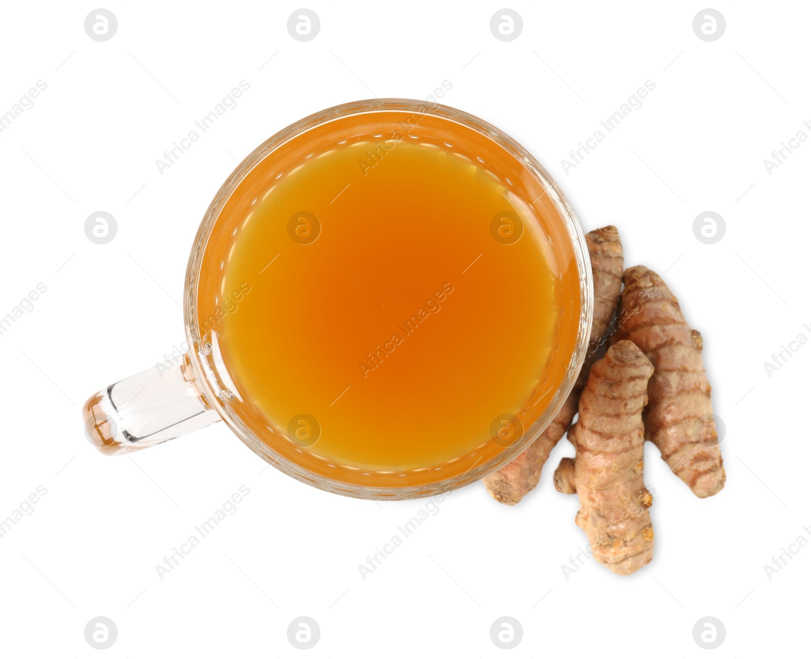 Photo of Aromatic turmeric tea in glass cup and roots isolated on white, top view