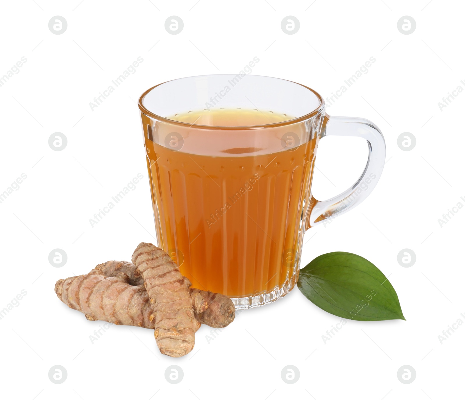 Photo of Aromatic turmeric tea in glass cup, green leaf and roots isolated on white