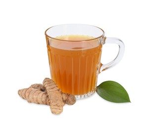 Photo of Aromatic turmeric tea in glass cup, green leaf and roots isolated on white