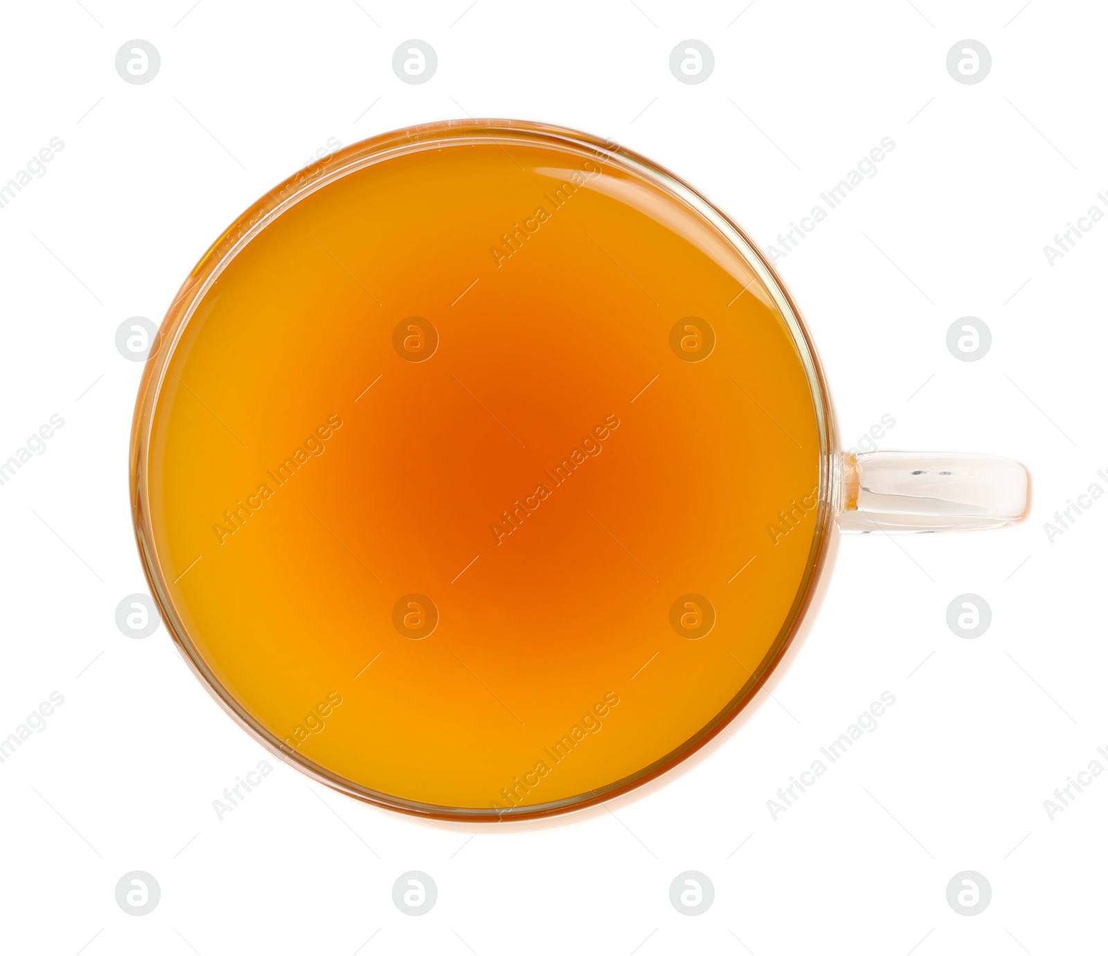 Photo of Aromatic turmeric tea in glass cup isolated on white, top view