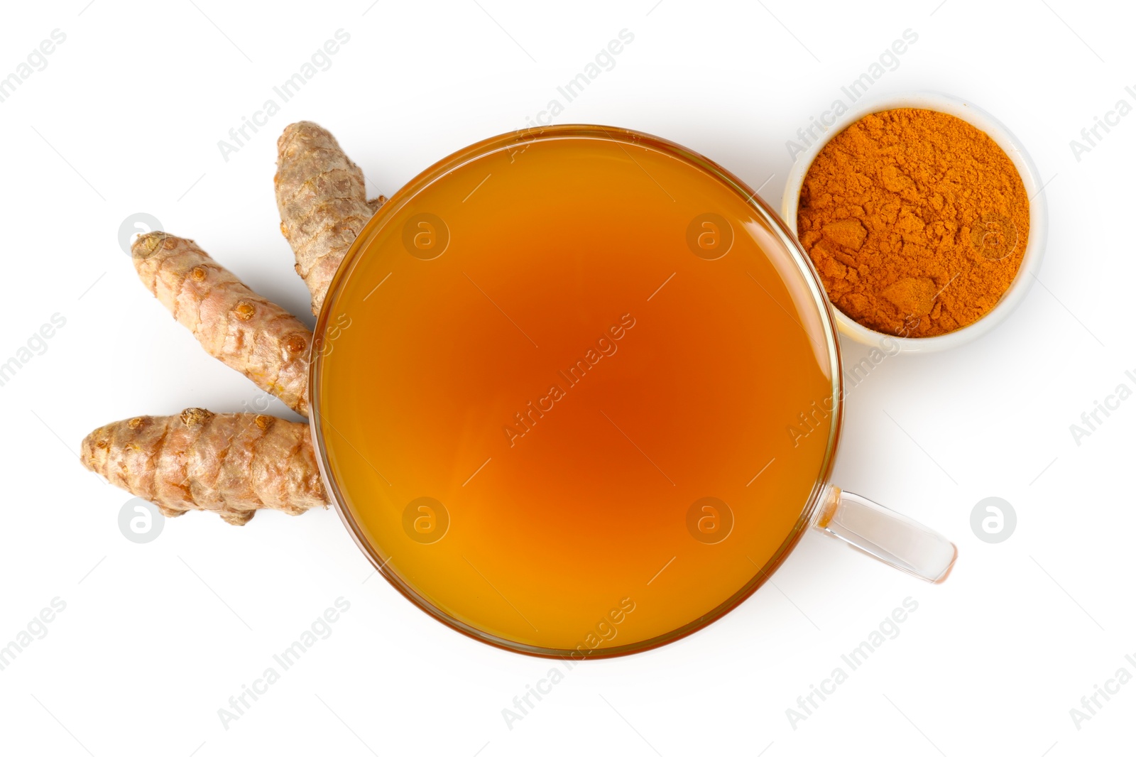 Photo of Aromatic turmeric tea in glass cup, roots and powder isolated on white, top view