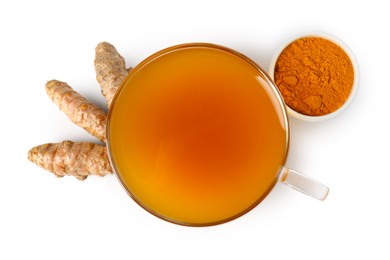 Photo of Aromatic turmeric tea in glass cup, roots and powder isolated on white, top view