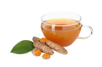 Photo of Aromatic turmeric tea in glass cup, roots and green leaf isolated on white