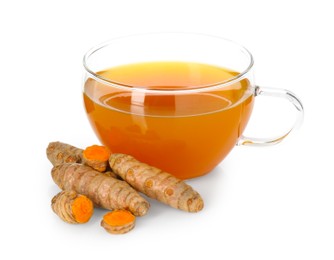 Photo of Aromatic turmeric tea in glass cup and roots isolated on white