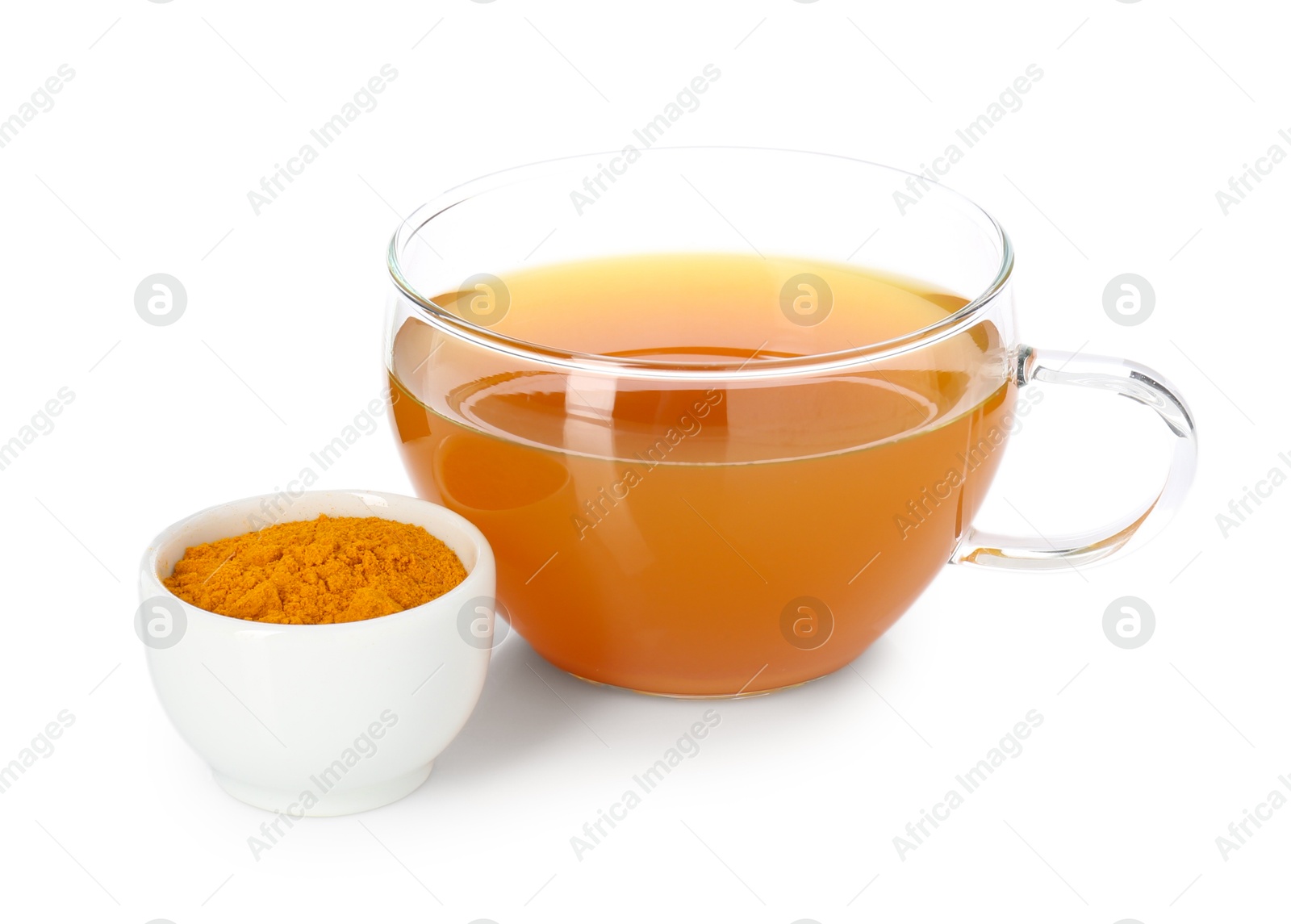 Photo of Aromatic turmeric tea in glass cup and powder isolated on white