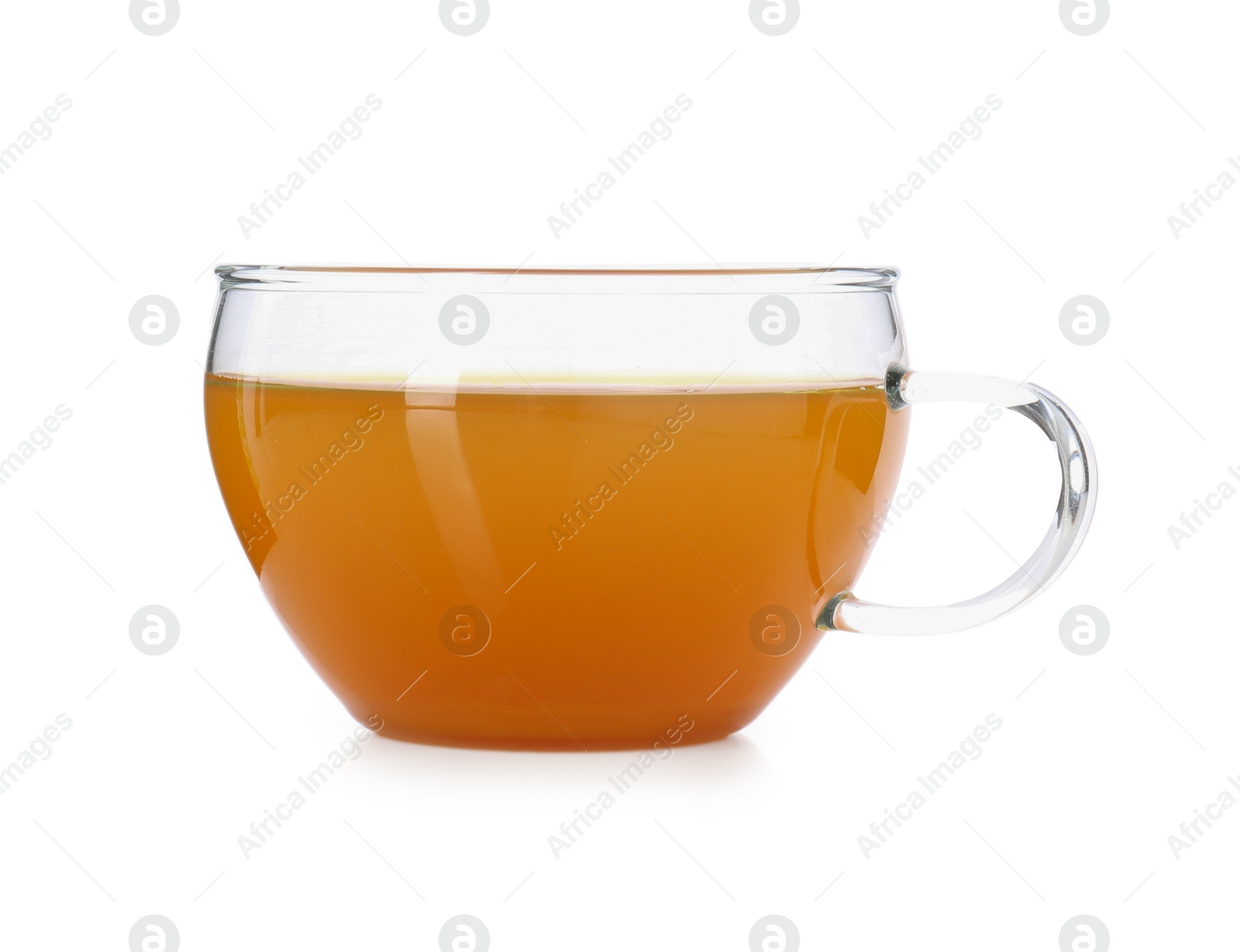 Photo of Aromatic turmeric tea in glass cup isolated on white