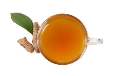 Photo of Aromatic turmeric tea in glass cup, roots and green leaf isolated on white, top view