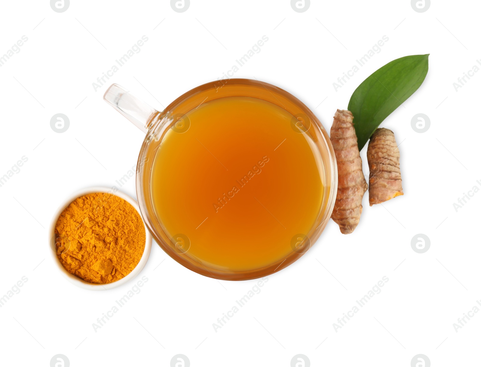 Photo of Aromatic turmeric tea in glass cup, roots, powder and green leaf isolated on white, top view