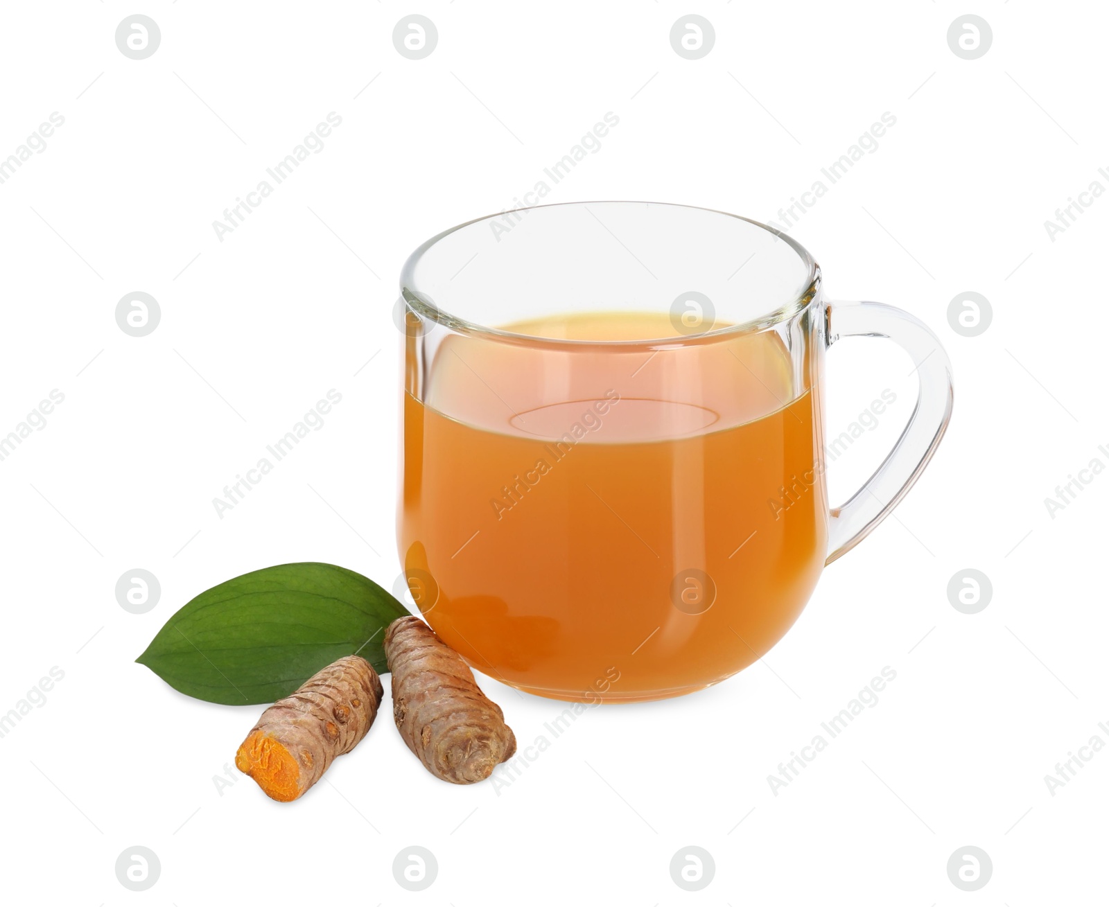 Photo of Aromatic turmeric tea in glass cup, roots and green leaf isolated on white