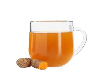 Photo of Aromatic turmeric tea in glass cup and roots isolated on white