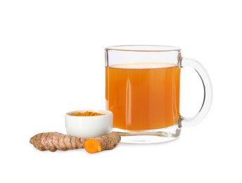 Photo of Aromatic turmeric tea in glass cup, roots and powder isolated on white