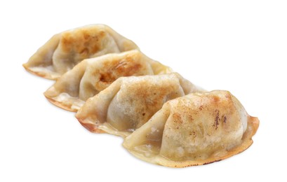 Photo of Delicious fried gyoza dumplings isolated on white