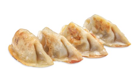 Photo of Delicious fried gyoza dumplings isolated on white