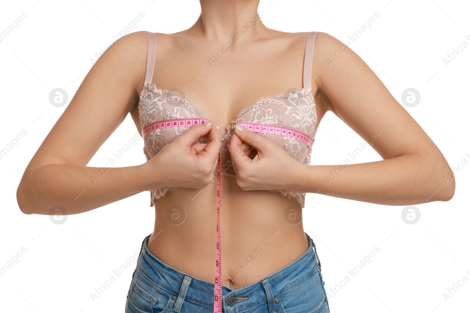 Photo of Woman in beautiful bra measuring breast circumference on white background, closeup