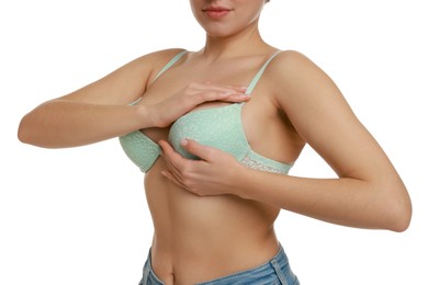 Photo of Woman wearing beautiful bra on white background, closeup