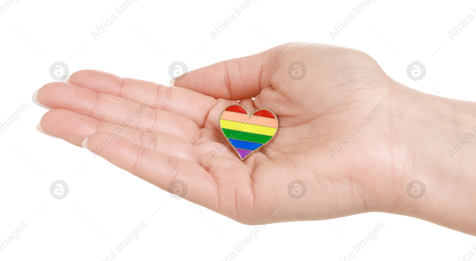 Photo of Woman with heart shaped pin in LGBT colors on white background, closeup