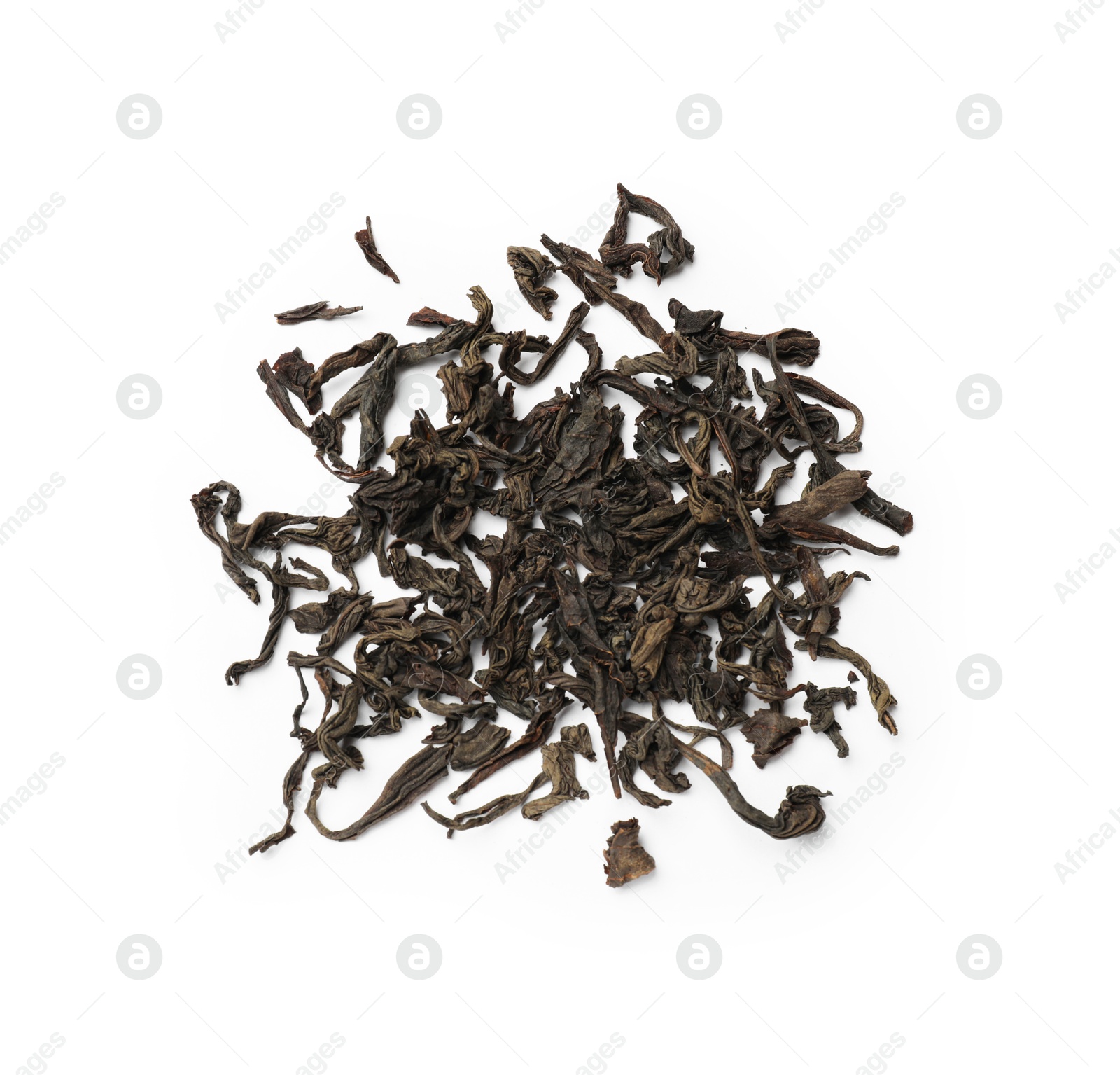 Photo of Pile of dry tea leaves isolated on white, top view