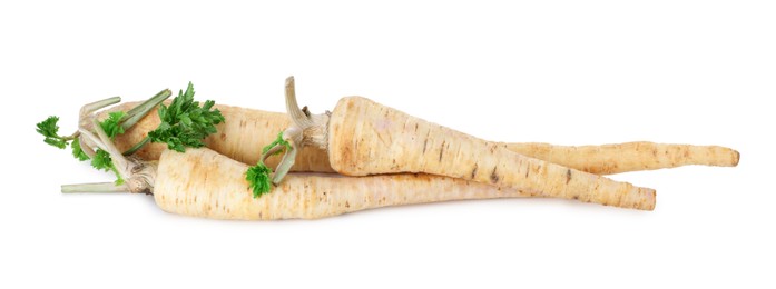 Photo of Fresh parsnips isolated on white. Root vegetable