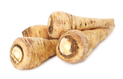 Photo of Many fresh parsnips isolated on white. Root vegetable