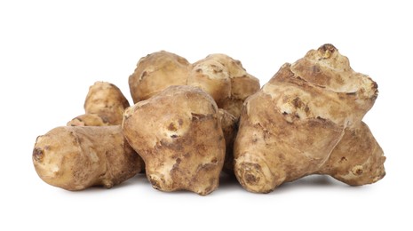 Photo of Fresh Jerusalem artichokes isolated on white. Root vegetable