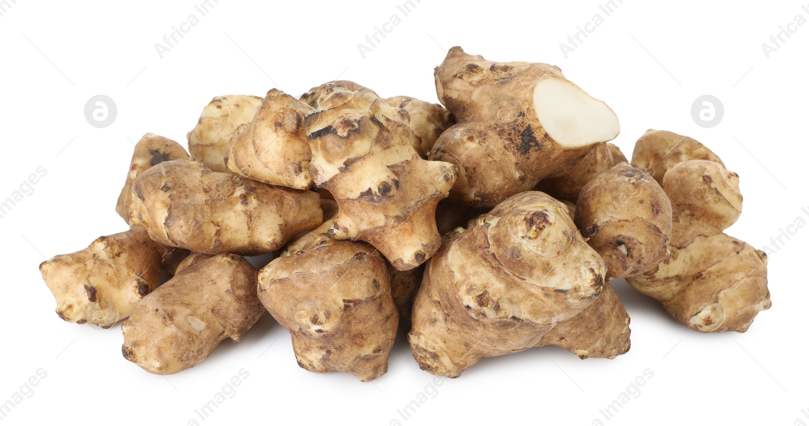 Photo of Fresh Jerusalem artichokes isolated on white. Root vegetable