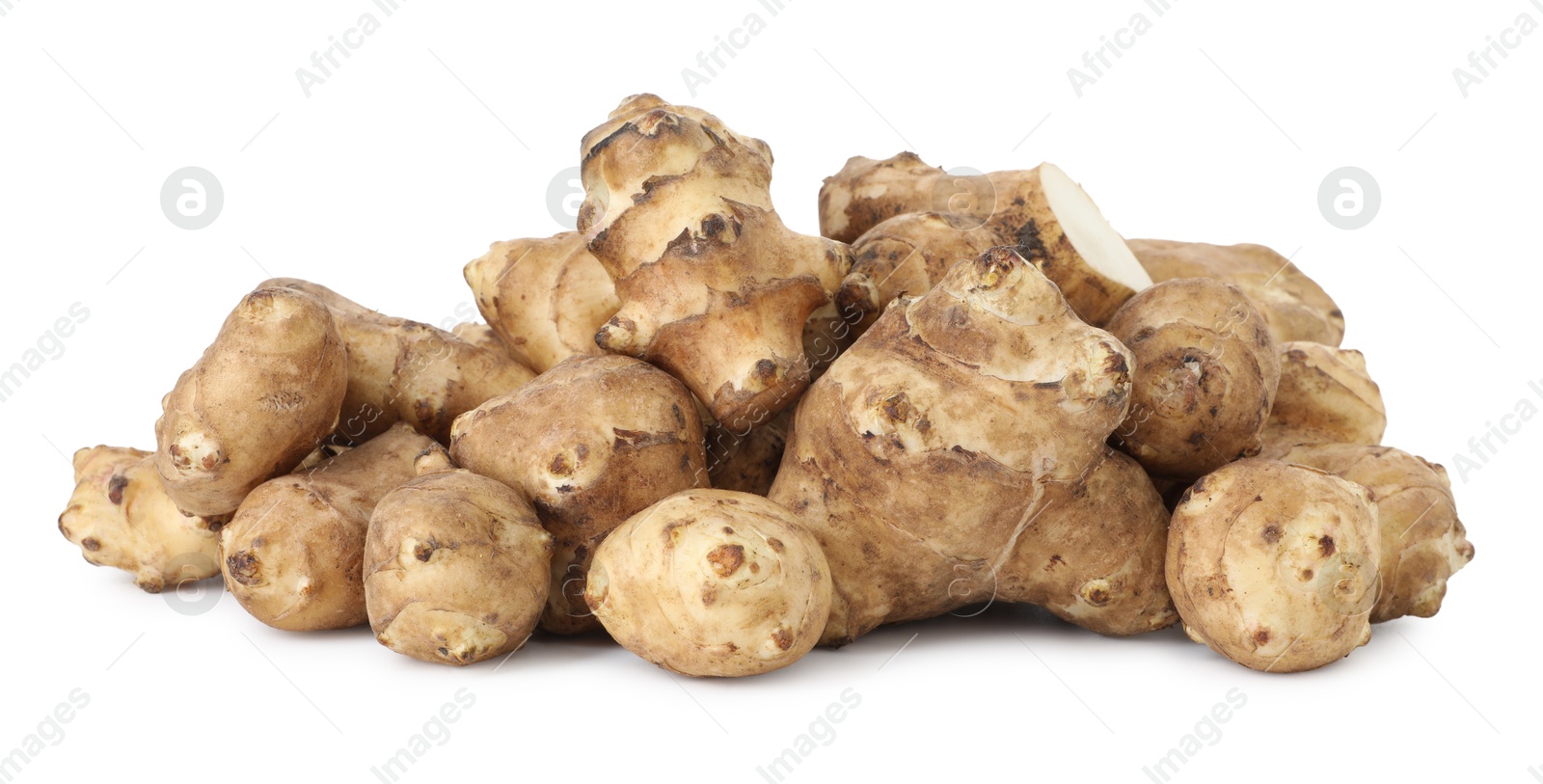 Photo of Fresh Jerusalem artichokes isolated on white. Root vegetable