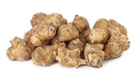 Photo of Fresh Jerusalem artichokes isolated on white. Root vegetable