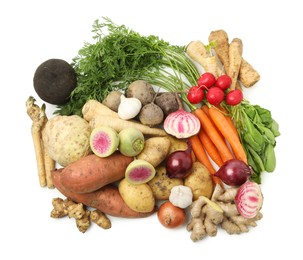 Photo of Many different root vegetables isolated on white, top view