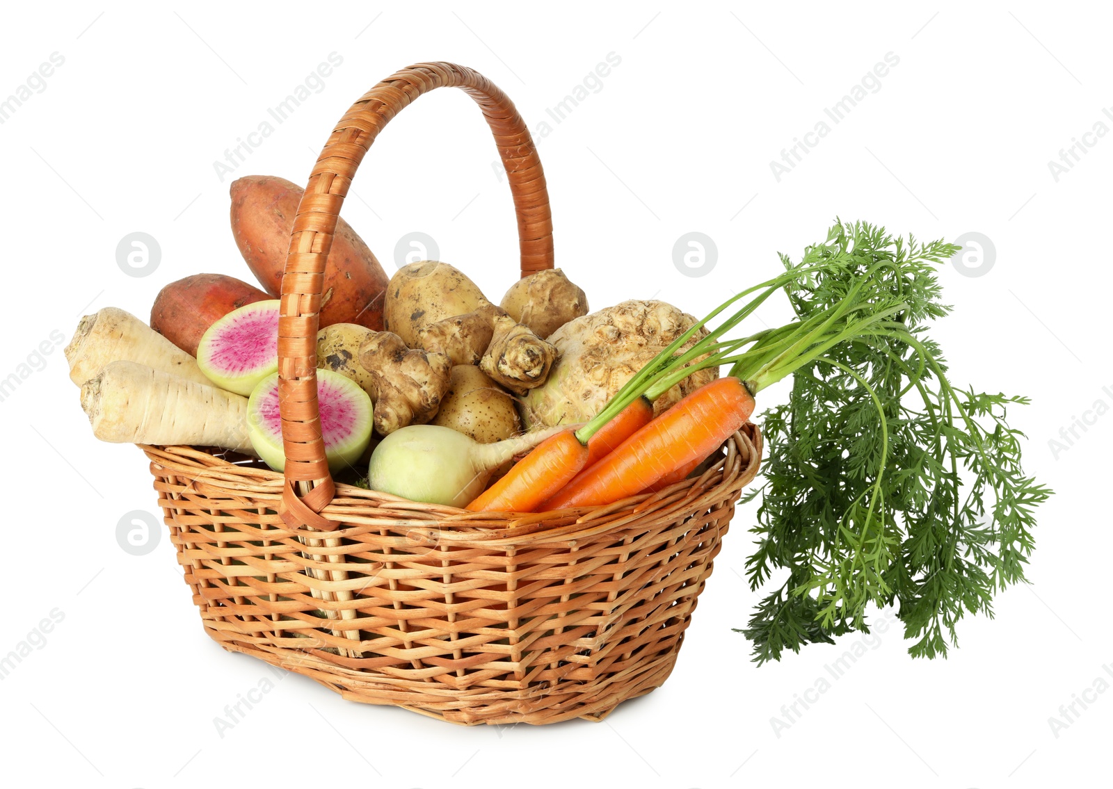 Photo of Different root vegetables in wicker basket isolated on white