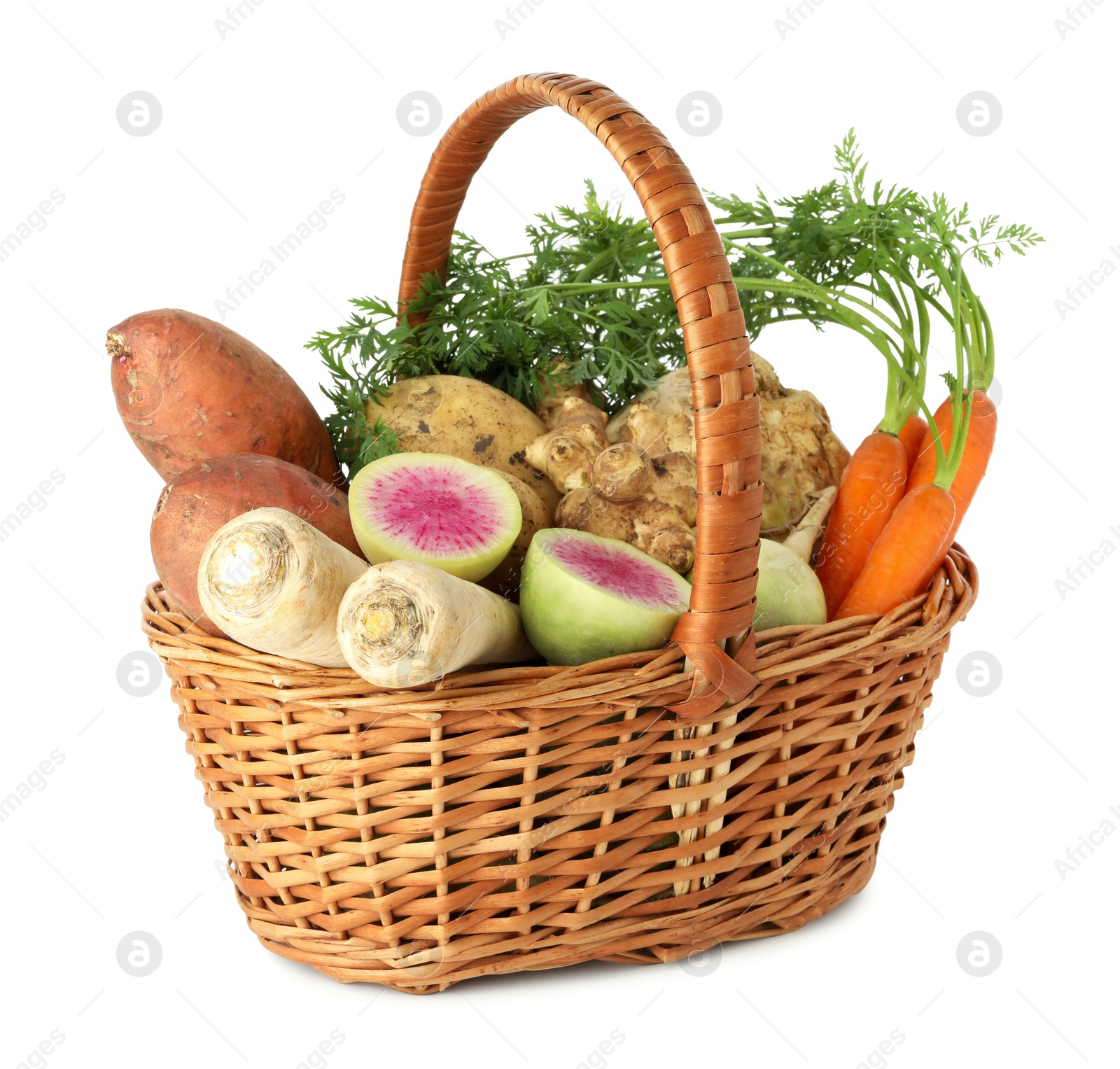 Photo of Different root vegetables in wicker basket isolated on white