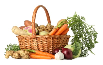 Photo of Different root vegetables in wicker basket isolated on white