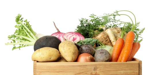 Photo of Different root vegetables in wooden crate isolated on white