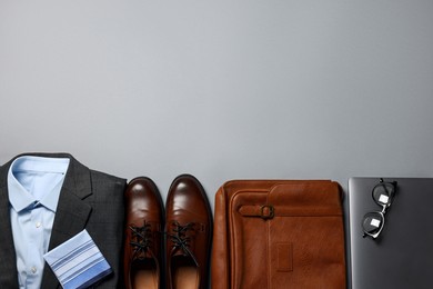 Photo of Elegant men's outfit. Stylish clothes, accessories and shoes on grey background, flat lay. Space for text