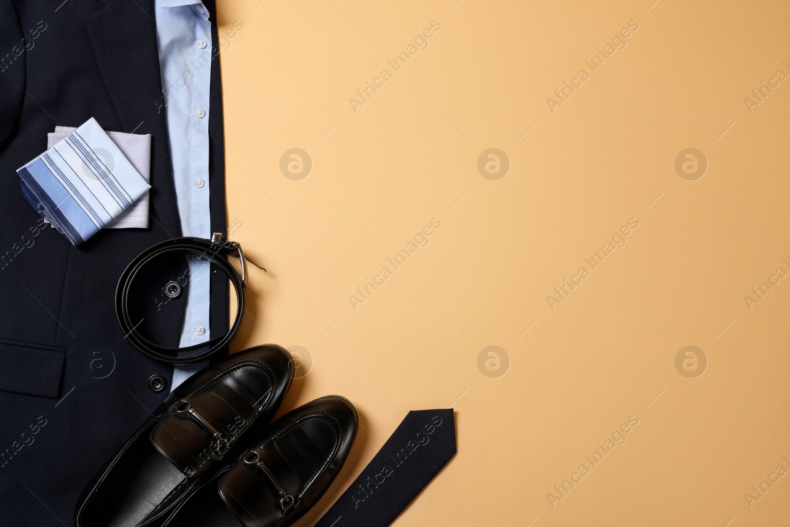 Photo of Elegant men's outfit. Stylish clothes, accessories and shoes on beige background, flat lay. Space for text